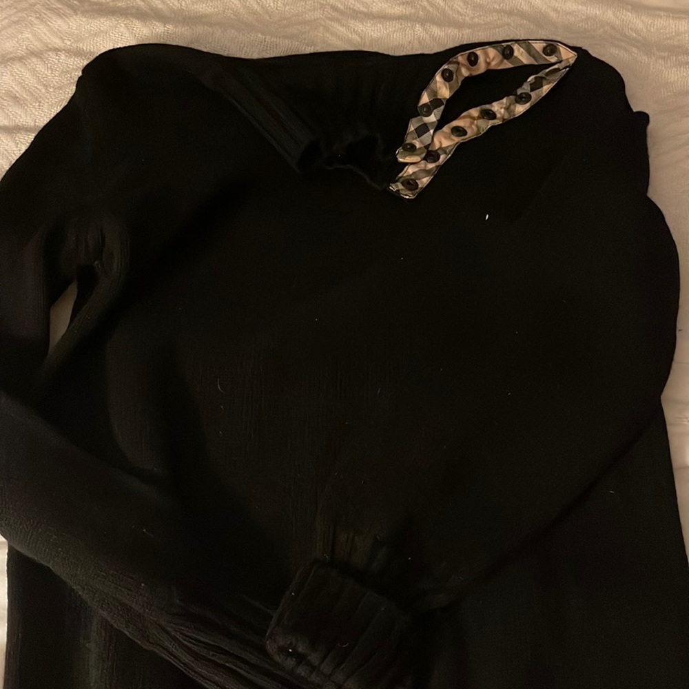 Black Marino extra fine sweater with collar. Plaid trim